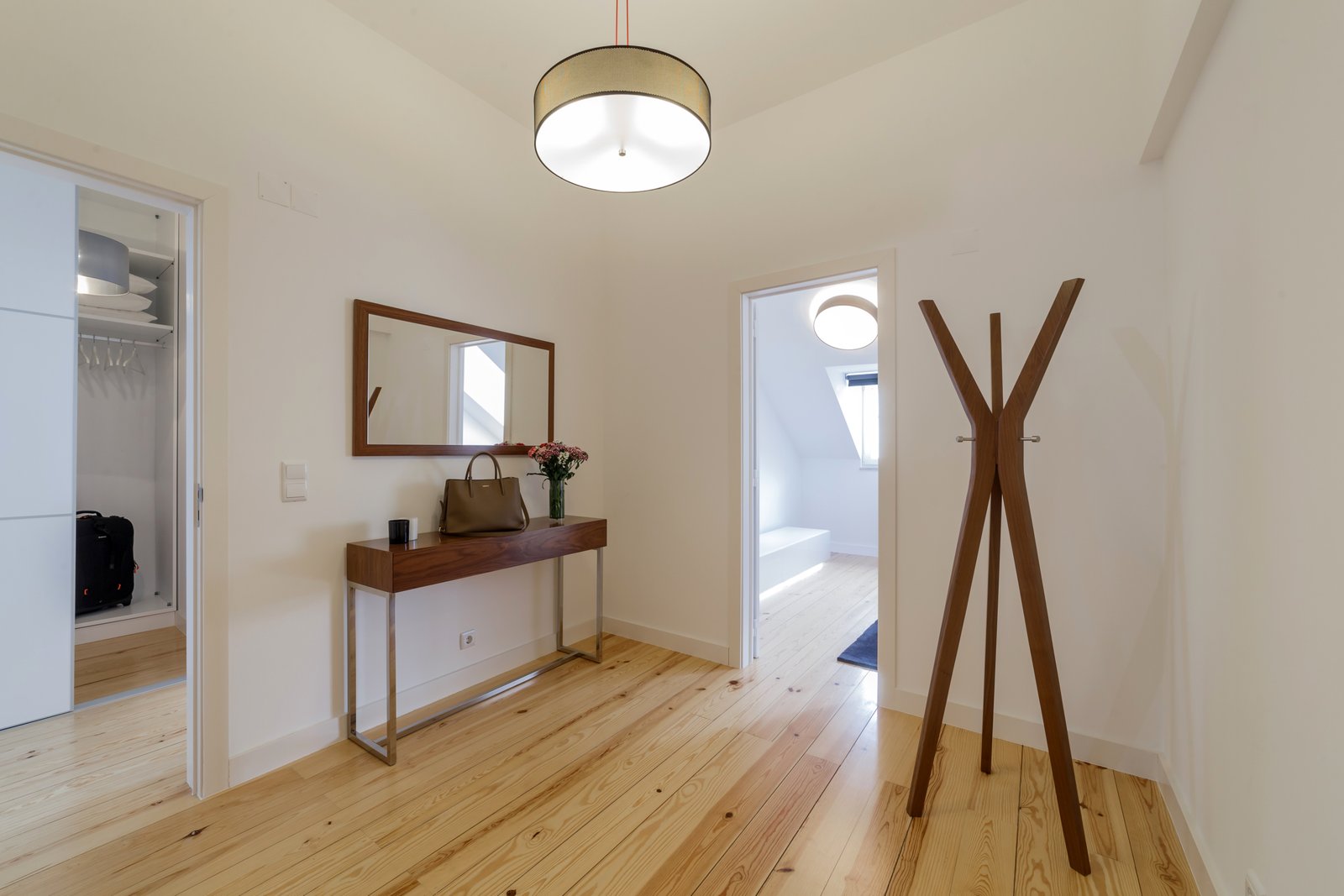 Modern apartment with white walls and light wooden floor Loft conversion apartment